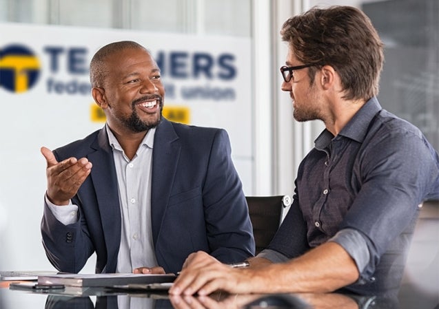 2 people talking and smiling